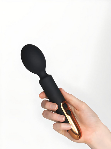 Rocks Off Oriel Ultimate Couples Play Wand Vibrator being held by a hand, showcasing its ergonomic design and luxurious aesthetics, ideal for enhancing sensual play between couples.